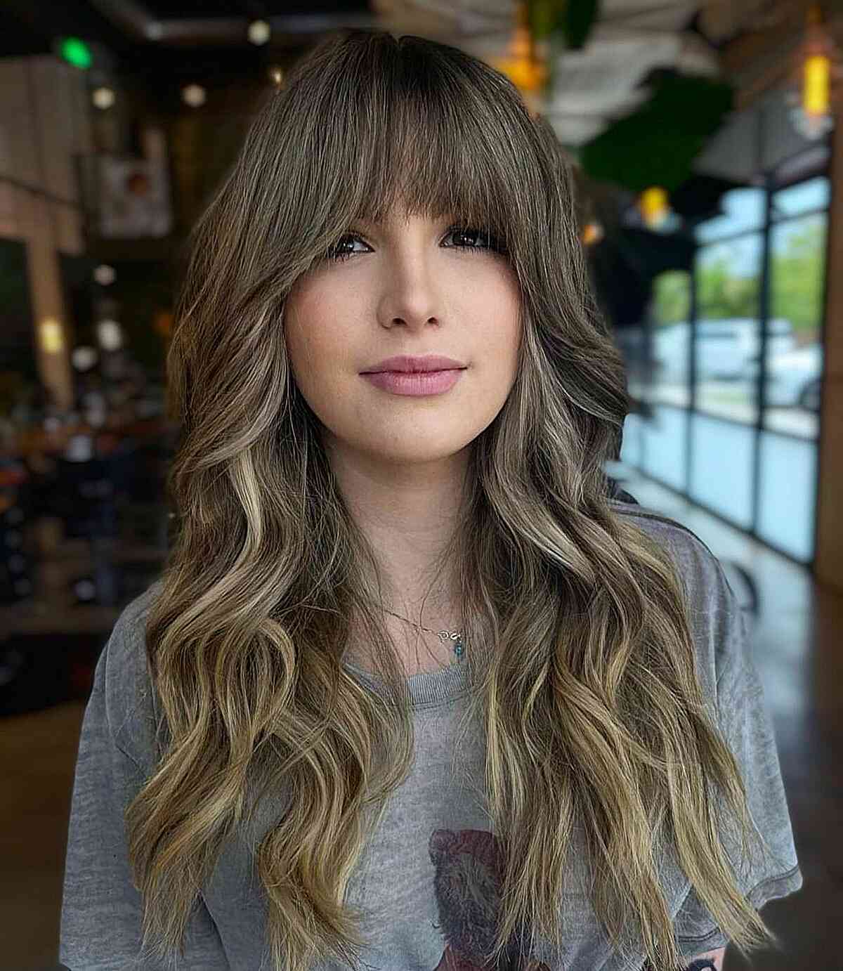 Ash Brown Long Hair with Full Bangs on women with wavy hair