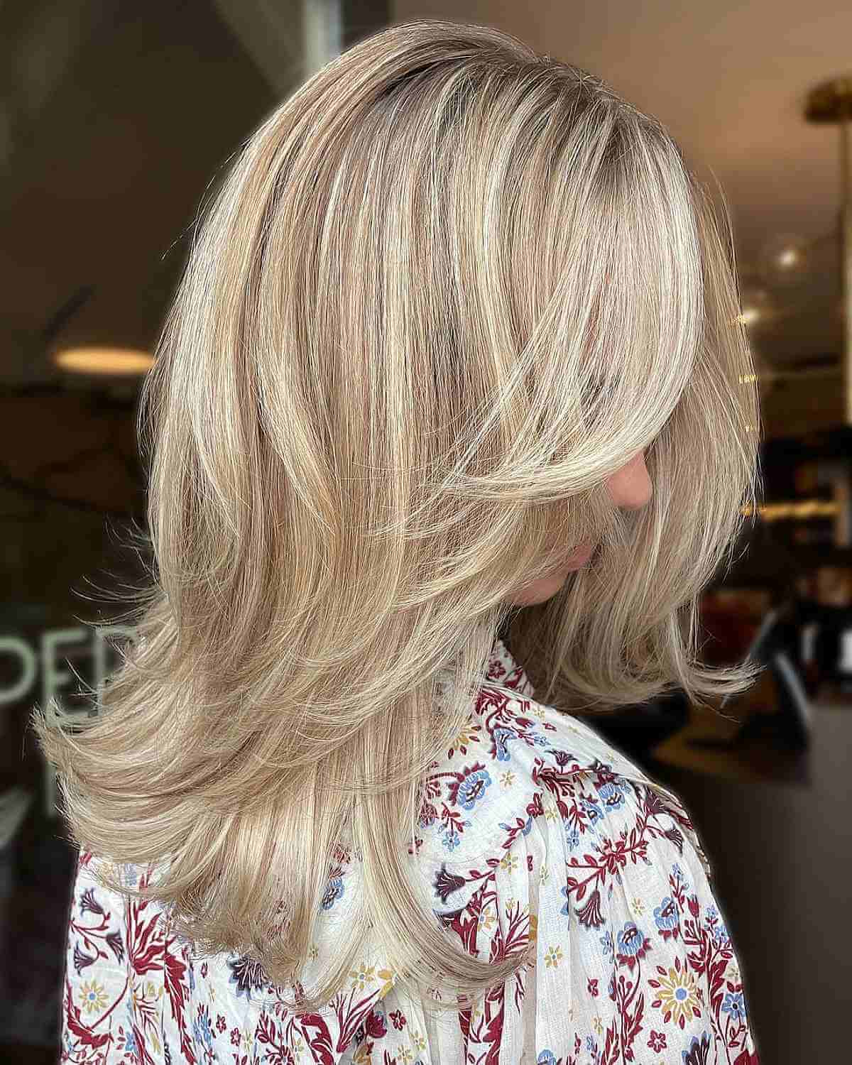 Cute Medium Butterfly Layered Haircut with Blonde Balayage