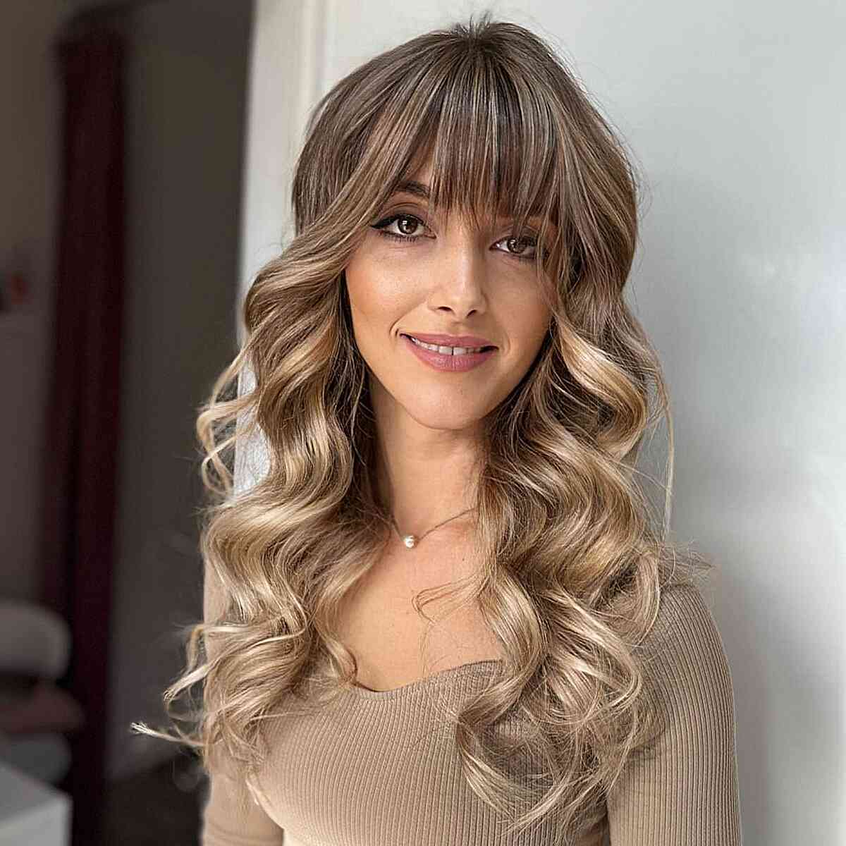 Full Thick Bangs for Long Balayage Hair on women with long faces