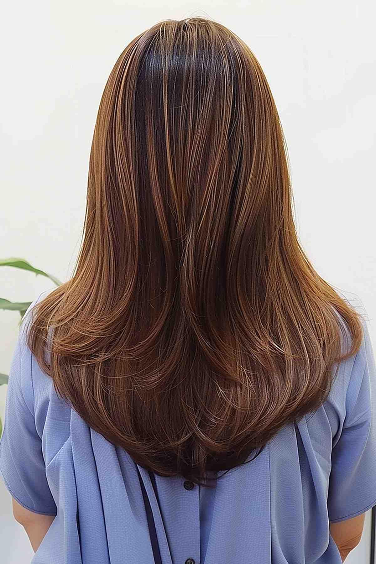 Medium cut with V-cut layers for straighter hair.