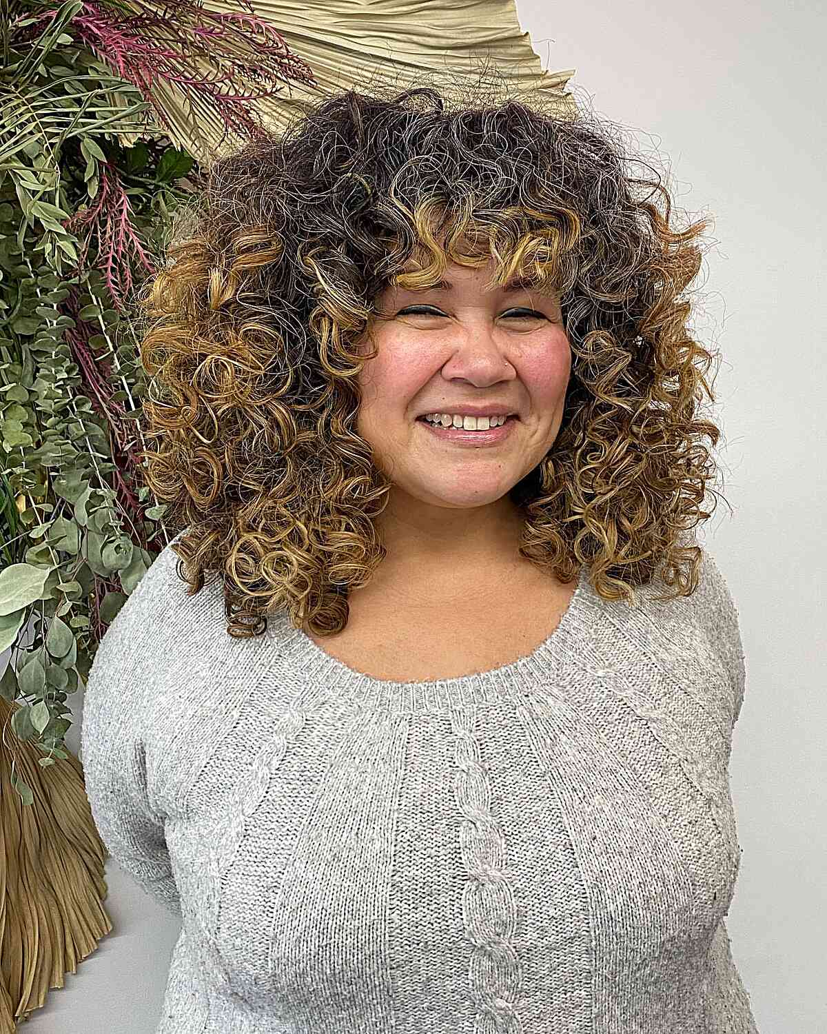 Medium-Length Deva-Cut Thick Curls for Round Faces and prominent cheekbones