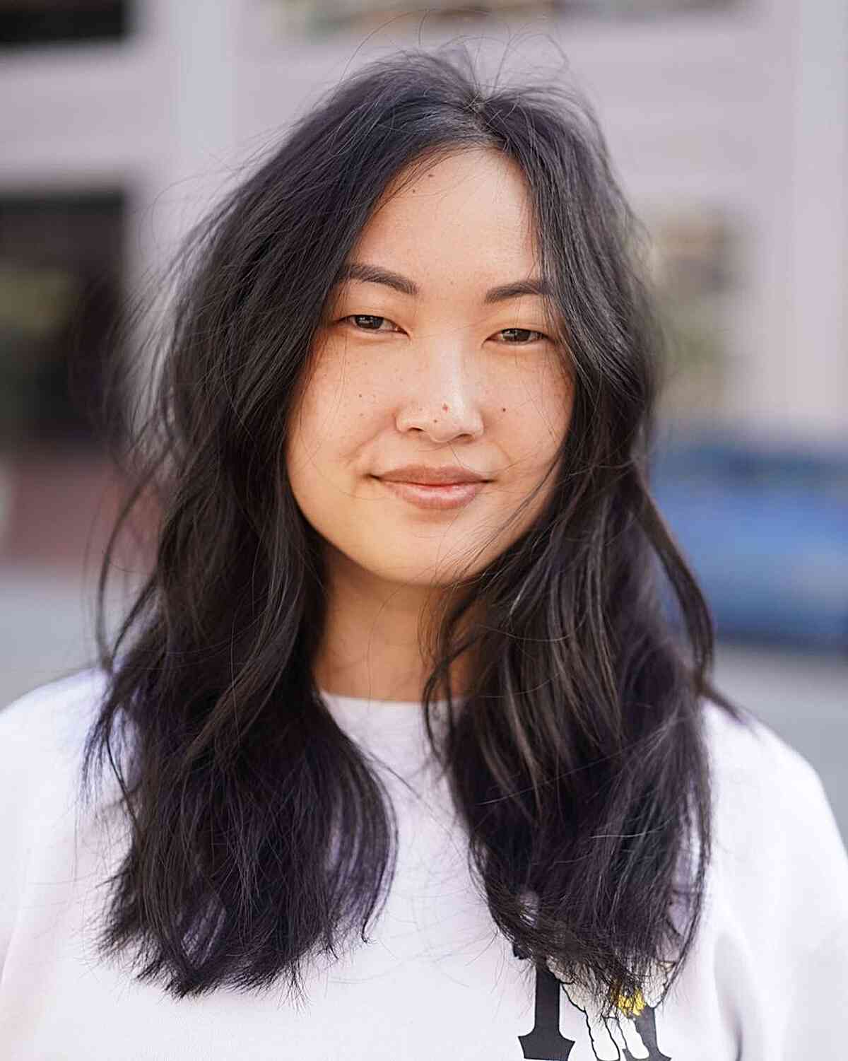 Modern Middle-Parted Shaggy Mid-Length Cut for Round Faces and fine hair