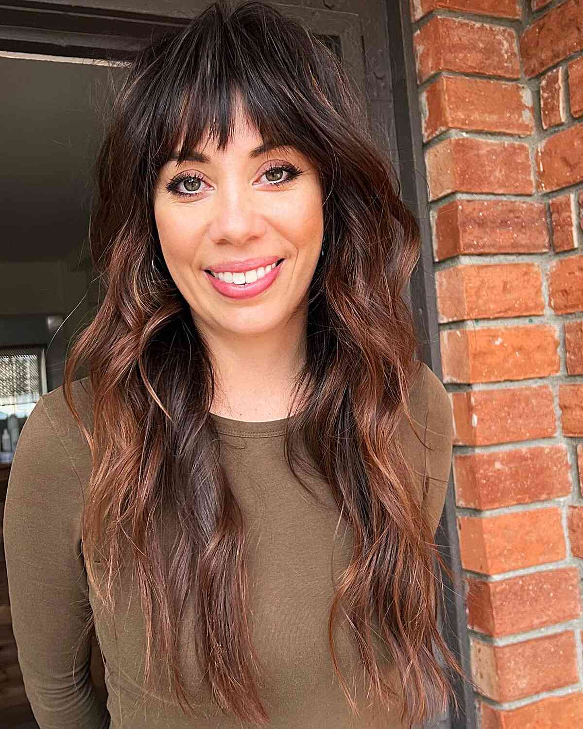 Warm Balayage on Long Layered Hair with Bangs for low-maintenance women